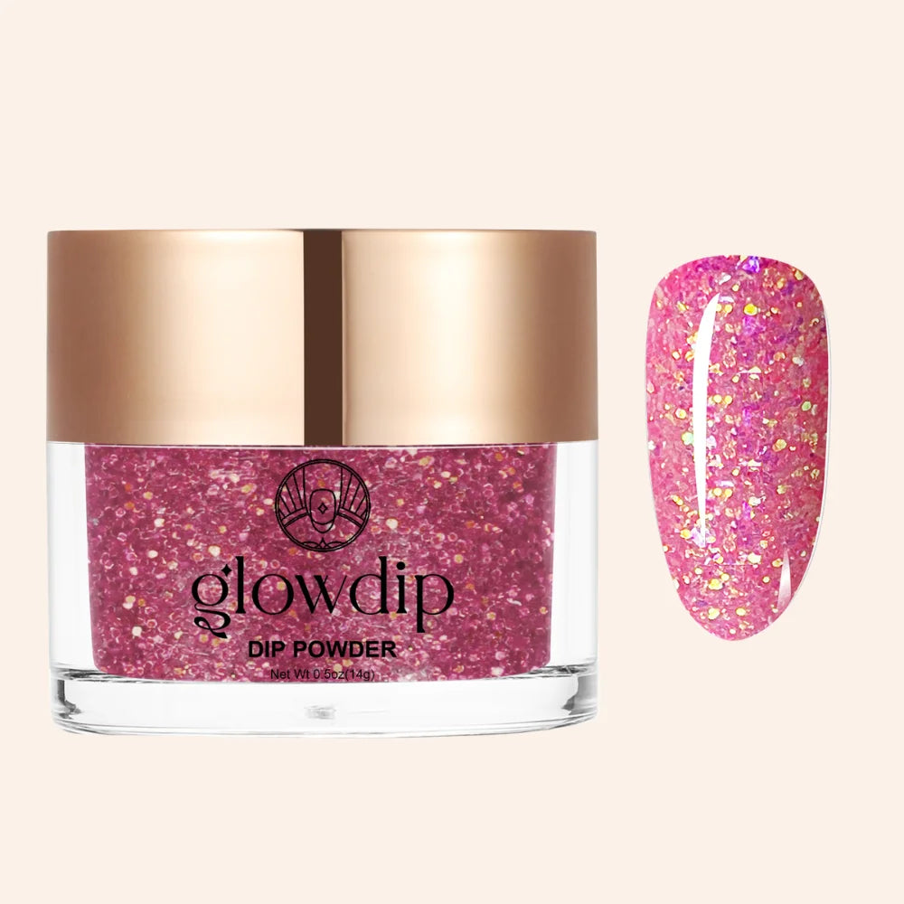 Een levendige roze glitterige dip poeder in een helder glazen potje met roségouden deksel van Glowdip Birthday Bling