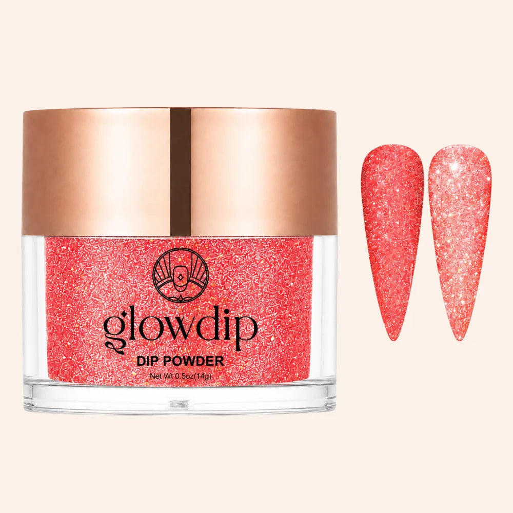 Een levendige koraal glitter dip poeder in een glazen pot met roségouden deksel van glowdip limited edition 11 fire flash